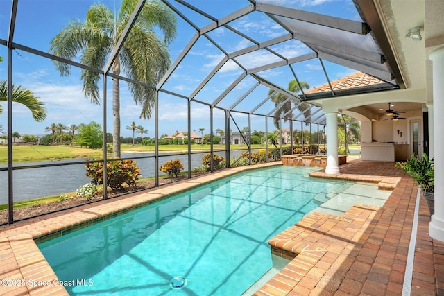 7346 Gorda Peak Ct, Melbourne, FL 32940 - view of pool with a patio area, a water view, ceiling fan, glass enclosure, and a pool with connected hot tub