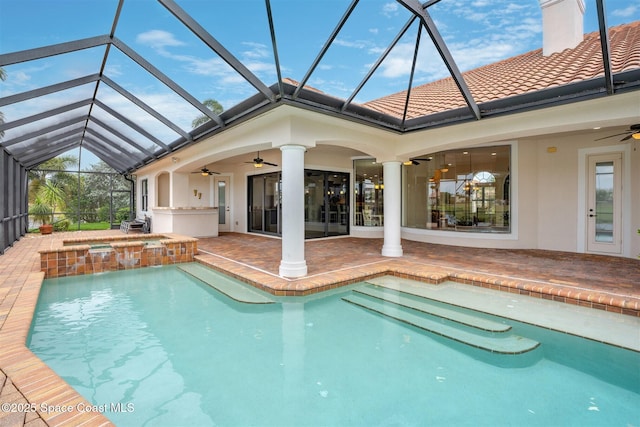 7346 Gorda Peak Ct, Melbourne, FL 32940 - rear view of property with ceiling fan, a chimney, a patio area, a tile roof, and glass enclosure