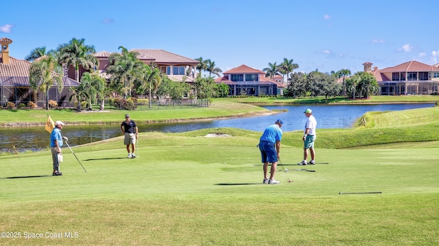 7346 Gorda Peak Ct, Melbourne, FL 32940 - view of property's community featuring a water view, a lawn, and view of golf course
