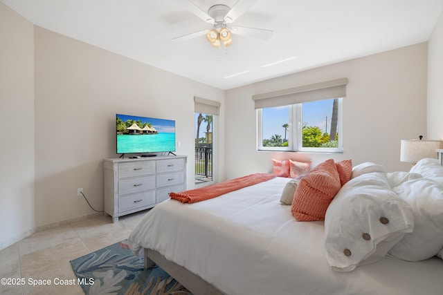bedroom featuring access to outside, a ceiling fan, and baseboards