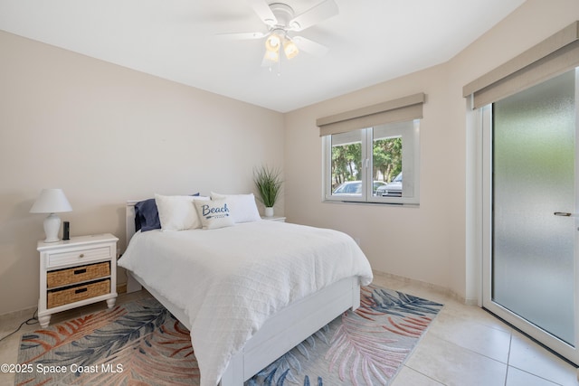 bedroom featuring light tile patterned floors and ceiling fan