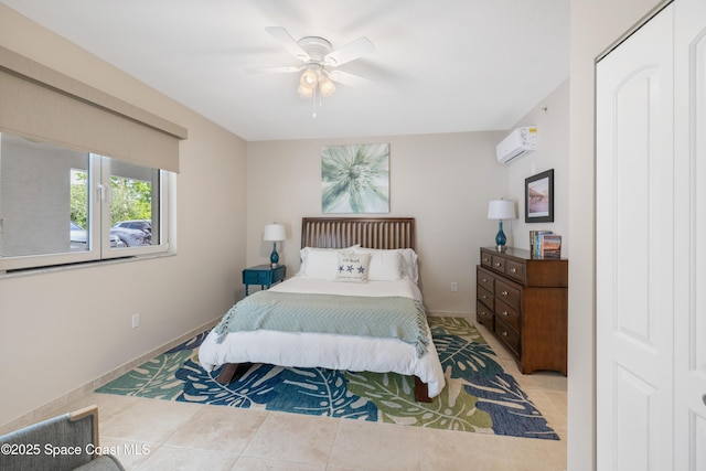 bedroom with tile patterned flooring, baseboards, ceiling fan, and an AC wall unit