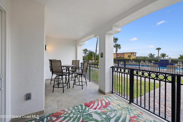 balcony with outdoor dining area