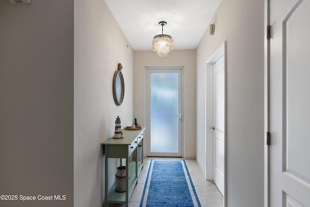entryway featuring light tile patterned floors