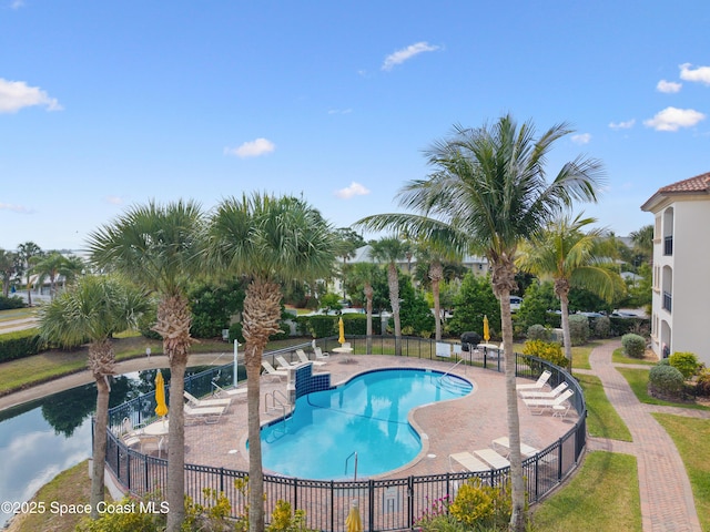 pool featuring a patio and fence
