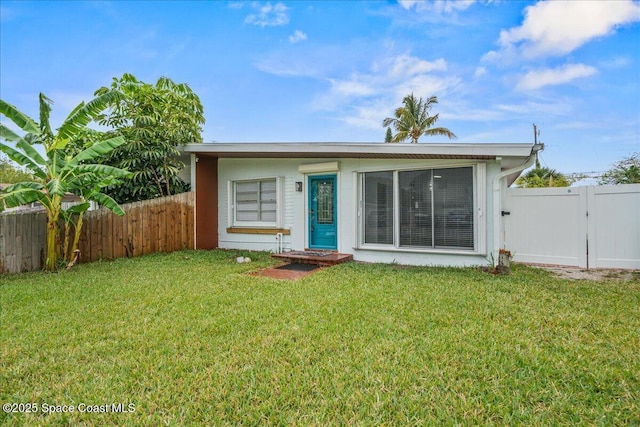 215 Jefferson Ave, Cape Canaveral, FL 32920 - view of front of property with a gate