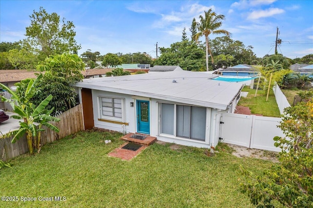 215 Jefferson Ave, Cape Canaveral, FL 32920 - rear view of property with a gate