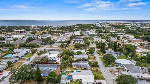 215 Jefferson Ave, Cape Canaveral, FL 32920 - aerial view of property and surrounding area featuring nearby suburban area and a large body of water