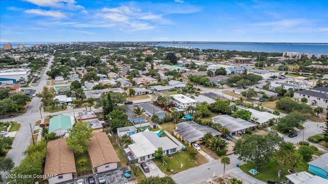 215 Jefferson Ave, Cape Canaveral, FL 32920 - aerial perspective of suburban area with a large body of water