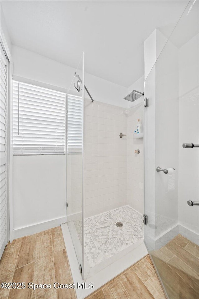 215 Jefferson Ave, Cape Canaveral, FL 32920 - bathroom with a shower stall and wood finished floors