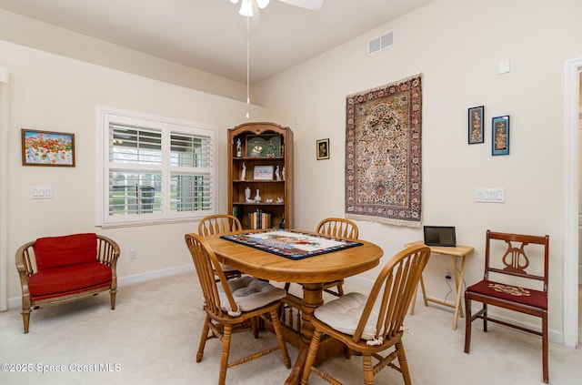 730 Sunset Lakes Dr, Merritt Island, FL 32953 - dining space with light colored carpet, a ceiling fan, and baseboards
