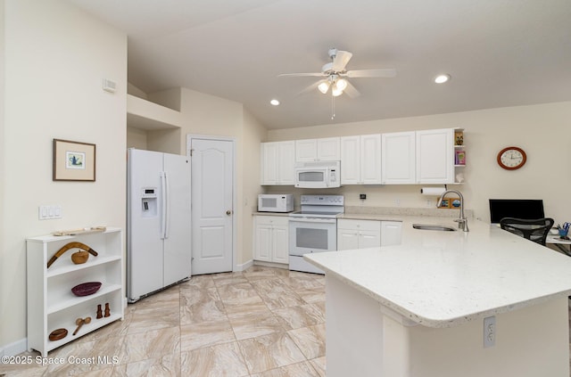 730 Sunset Lakes Dr, Merritt Island, FL 32953 - kitchen with white appliances, open shelves, a sink, a peninsula, and white cabinetry