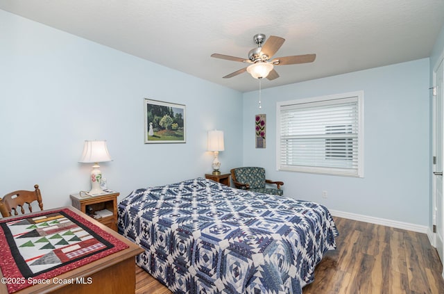 730 Sunset Lakes Dr, Merritt Island, FL 32953 - bedroom with wood finished floors, baseboards, and a ceiling fan