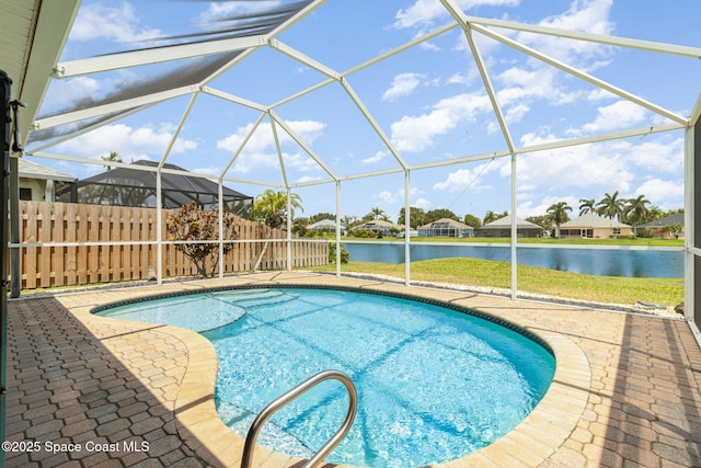 730 Sunset Lakes Dr, Merritt Island, FL 32953 - swimming pool with a water view, a patio, glass enclosure, and a residential view