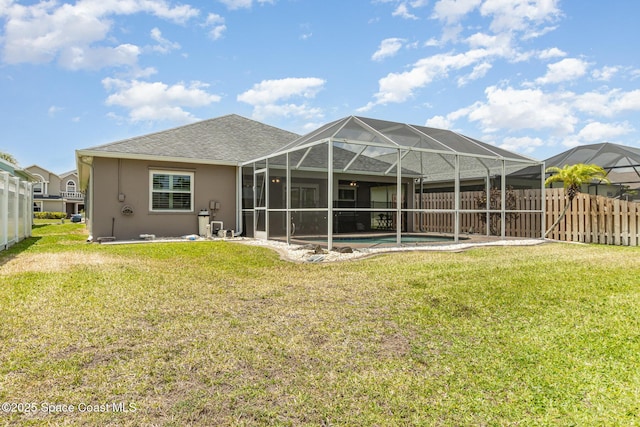 730 Sunset Lakes Dr, Merritt Island, FL 32953 - rear view of property with stucco siding and a lanai