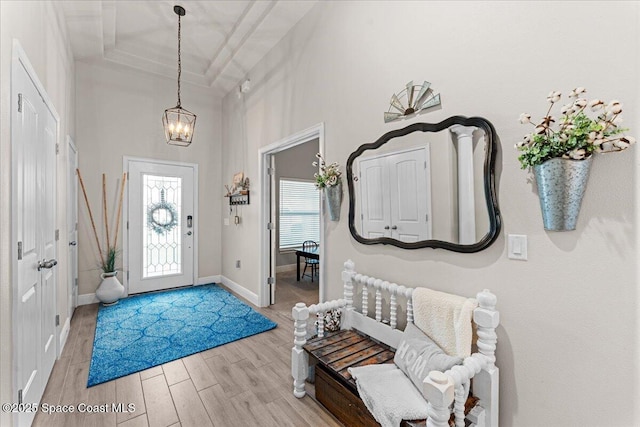 7268 Preserve Pointe Dr, Merritt Island, FL 32953 - foyer with a chandelier, wood finished floors, and baseboards