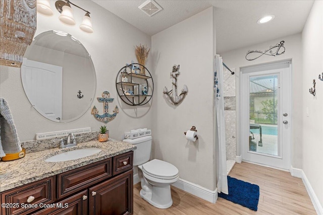 7268 Preserve Pointe Dr, Merritt Island, FL 32953 - full bath featuring wood finished floors, vanity, toilet, a shower with curtain, and baseboards