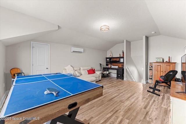7268 Preserve Pointe Dr, Merritt Island, FL 32953 - game room featuring a wall unit AC, vaulted ceiling, and wood finished floors