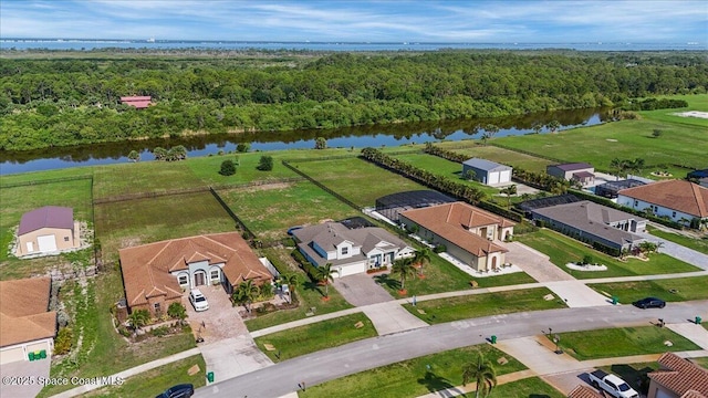 7268 Preserve Pointe Dr, Merritt Island, FL 32953 - aerial perspective of suburban area with a nearby body of water and a heavily wooded area