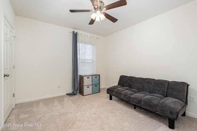 735 Sorrento Dr, Cocoa, FL 32922 - sitting room with light colored carpet, ceiling fan, and baseboards