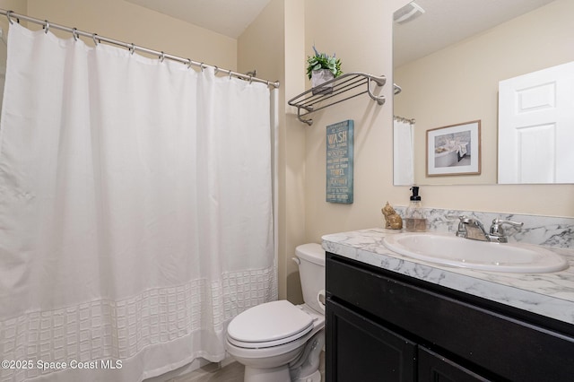 735 Sorrento Dr, Cocoa, FL 32922 - full bathroom featuring toilet, vanity, and a shower with shower curtain
