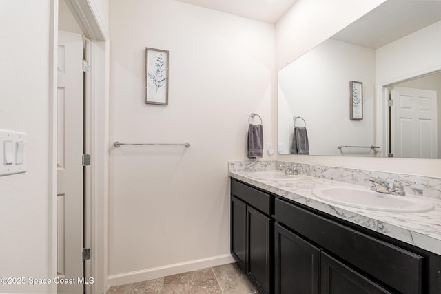 735 Sorrento Dr, Cocoa, FL 32922 - full bath with baseboards, double vanity, and stone finish flooring