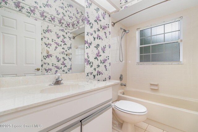 full bathroom featuring shower / bath combo with shower curtain, tile patterned flooring, toilet, vanity, and wallpapered walls