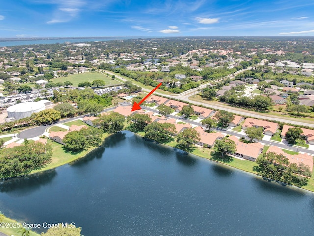 aerial perspective of suburban area featuring a large body of water