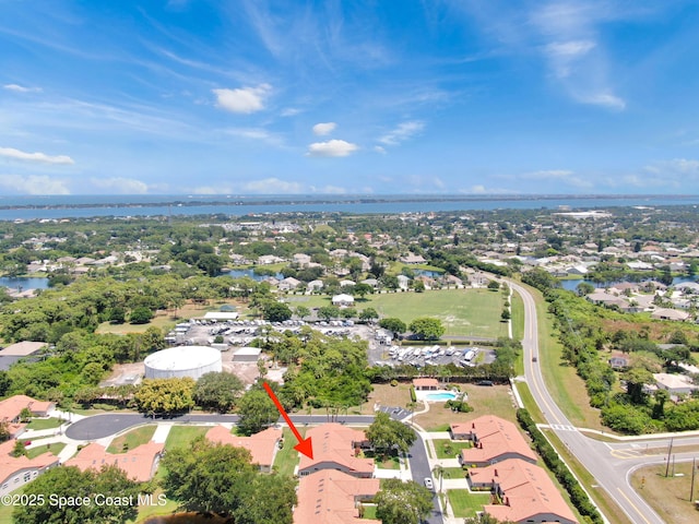 aerial perspective of suburban area featuring a nearby body of water