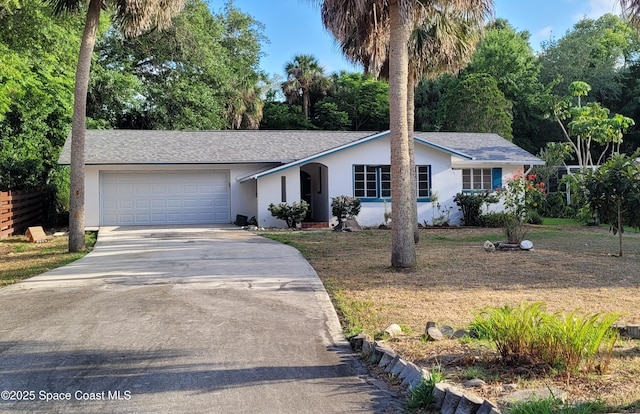 55 S Grandview Cir, Cocoa, FL 32922 - single story home featuring stucco siding, driveway, a garage, and roof with shingles