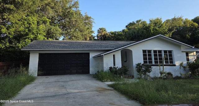 55 S Grandview Cir, Cocoa, FL 32922 - ranch-style house with a garage, stucco siding, driveway, and a shingled roof