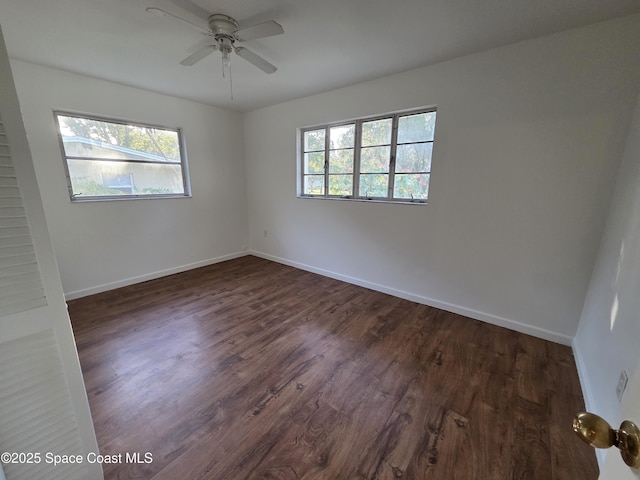 55 S Grandview Cir, Cocoa, FL 32922 - empty room featuring healthy amount of natural light, dark wood-type flooring, and a ceiling fan