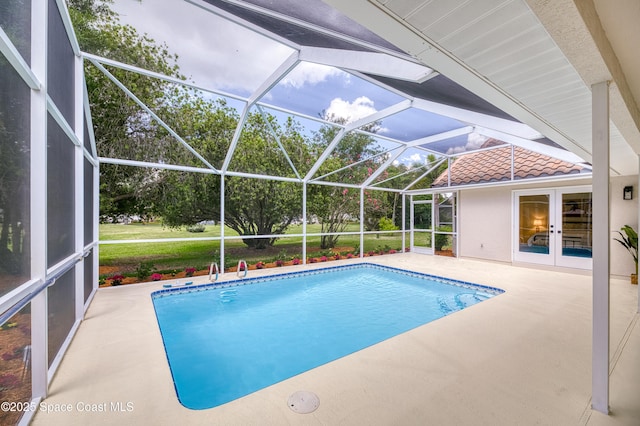 swimming pool featuring french doors, a patio, and glass enclosure