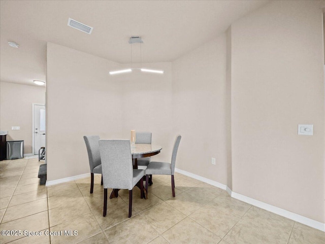 354 Dryden Cir, Cocoa, FL 32926 - dining space featuring light tile patterned floors and baseboards