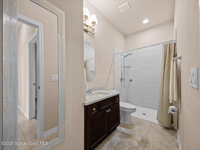 354 Dryden Cir, Cocoa, FL 32926 - bathroom with a tile shower, tile patterned flooring, vanity, and toilet