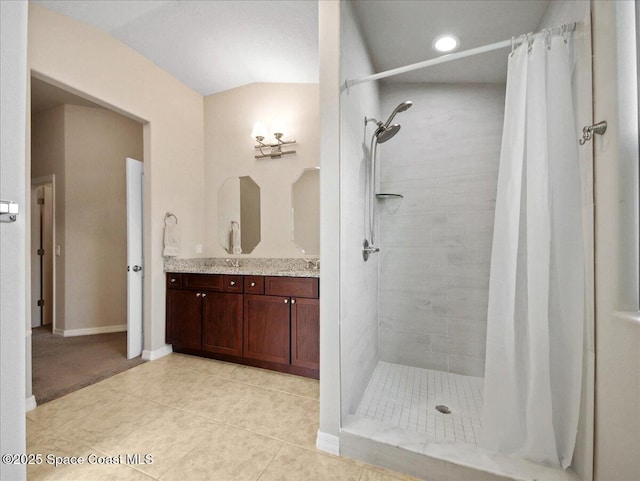 354 Dryden Cir, Cocoa, FL 32926 - full bathroom featuring a tile shower, tile patterned floors, vanity, and baseboards