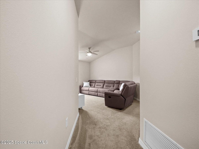 354 Dryden Cir, Cocoa, FL 32926 - living room featuring carpet flooring, ceiling fan, baseboards, and vaulted ceiling