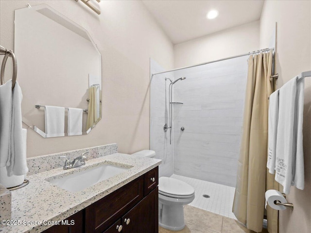 354 Dryden Cir, Cocoa, FL 32926 - full bath with a tile shower, toilet, vanity, tile patterned floors, and recessed lighting