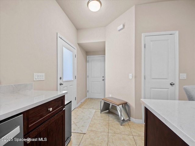 354 Dryden Cir, Cocoa, FL 32926 - laundry room with baseboards and light tile patterned floors