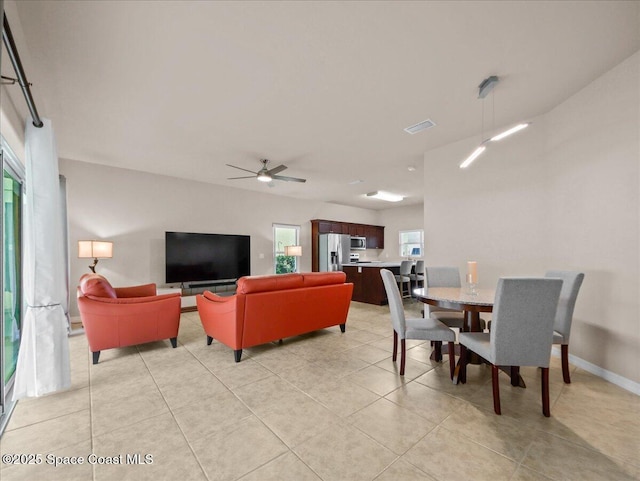 354 Dryden Cir, Cocoa, FL 32926 - dining room with ceiling fan and light tile patterned floors