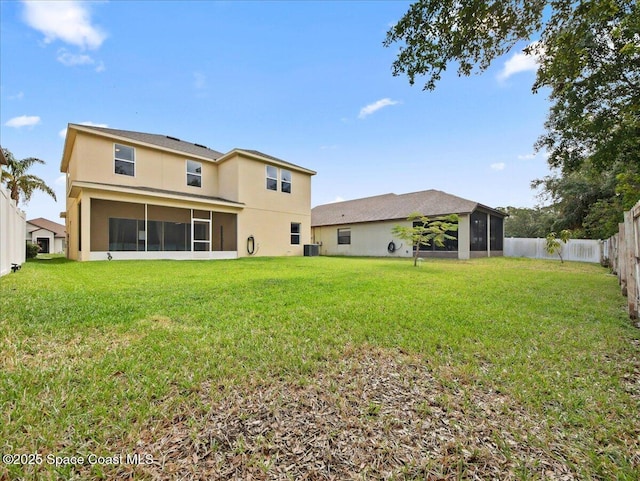 354 Dryden Cir, Cocoa, FL 32926 - rear view of house with a sunroom, stucco siding, and central AC