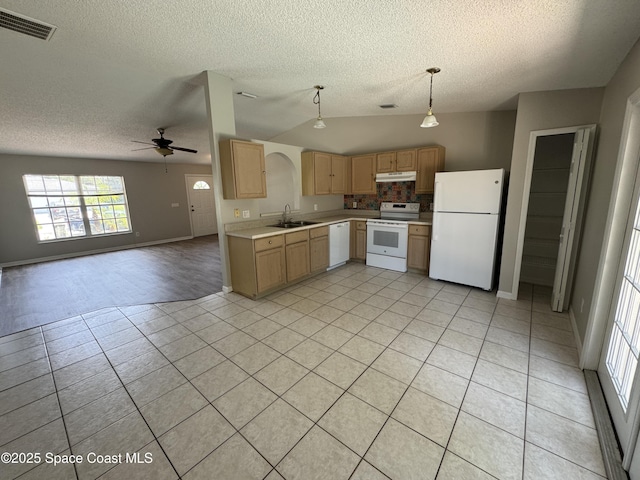 539 Olsmar St SW, Palm Bay, FL 32908 - kitchen with white appliances, a sink, a textured ceiling, light brown cabinetry, and open floor plan