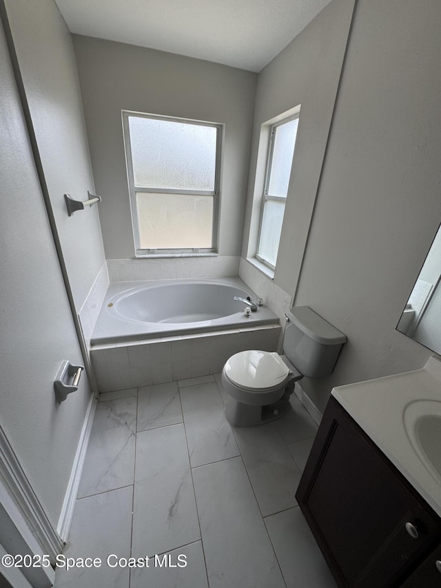 539 Olsmar St SW, Palm Bay, FL 32908 - full bathroom featuring marble finish flooring, toilet, a bath, and vanity