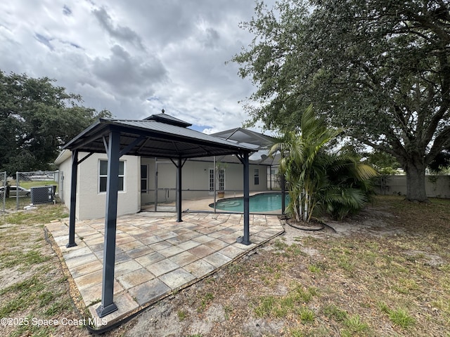 539 Olsmar St SW, Palm Bay, FL 32908 - back of property featuring a gazebo, a fenced backyard, stucco siding, and a patio