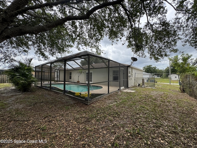 539 Olsmar St SW, Palm Bay, FL 32908 - rear view of house featuring fence and a lanai