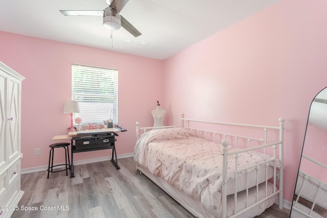 4920 48th Pl, Vero Beach, FL 32967 - bedroom featuring wood finished floors, baseboards, and a ceiling fan