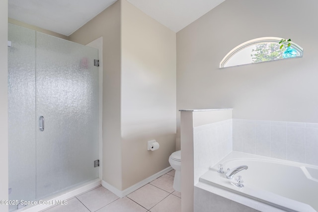 4920 48th Pl, Vero Beach, FL 32967 - bathroom featuring tile patterned floors, a bath, toilet, and a shower stall