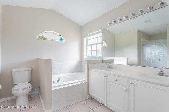 4920 48th Pl, Vero Beach, FL 32967 - full bath with toilet, tile patterned floors, a bath, lofted ceiling, and double vanity