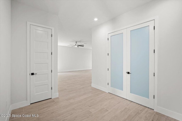 998 Wacona St SE, Palm Bay, FL 32909 - hallway featuring light wood-type flooring, baseboards, and recessed lighting