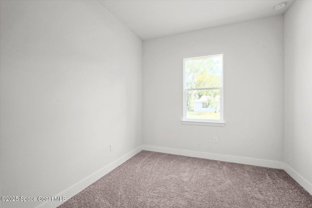 998 Wacona St SE, Palm Bay, FL 32909 - empty room with carpet flooring, baseboards, and a smoke detector